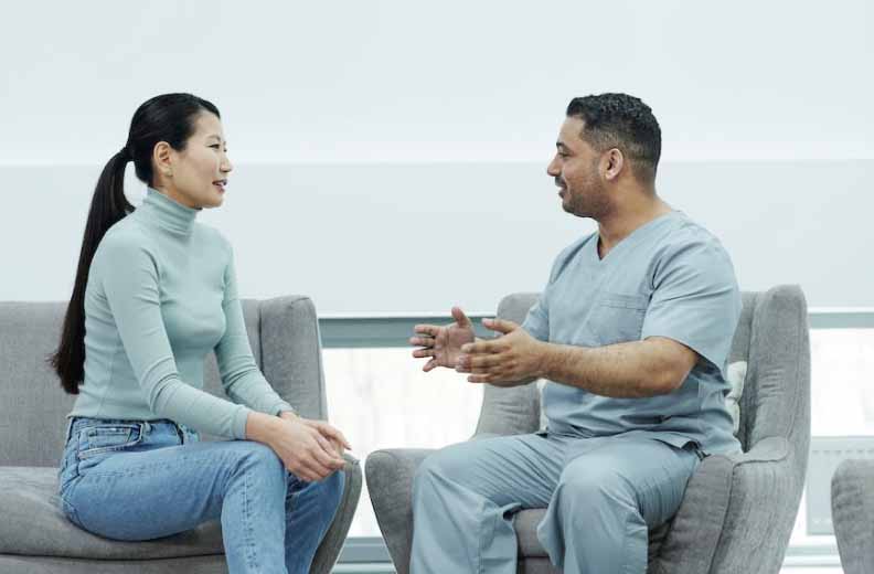Woman talking with medical professional