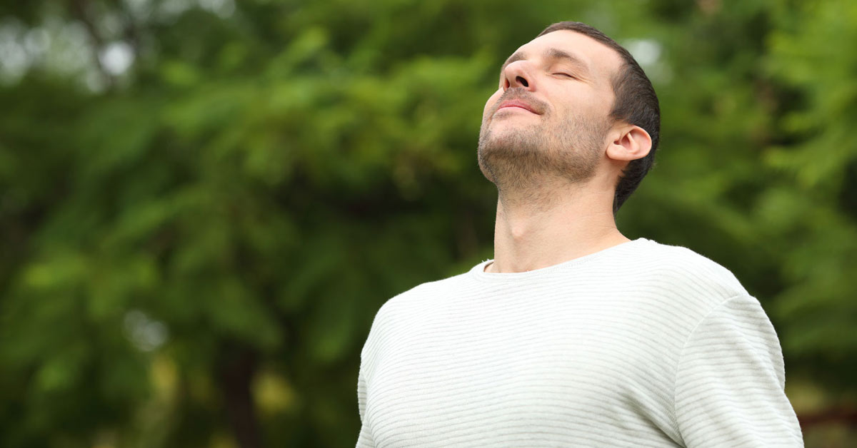 Man taking deep breath