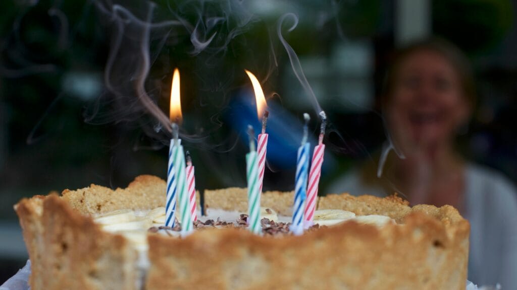 A cake with candles on top of it for a sober birthday celebration.