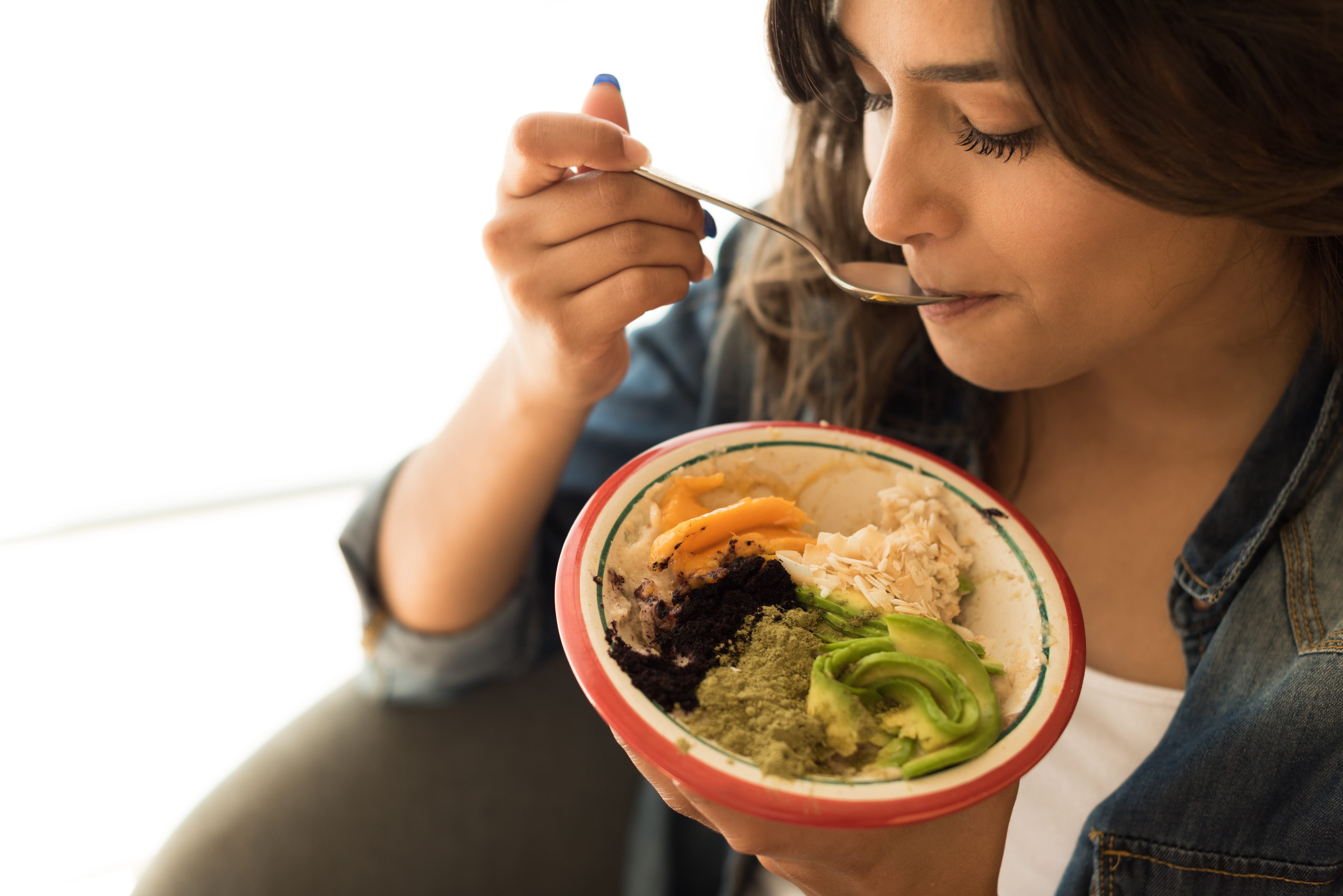 A person eating mood-boosting foods.