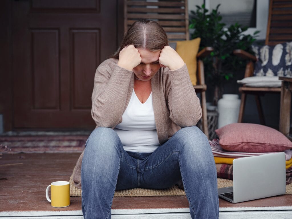 A woman suffering from postpartum depression (PPD).