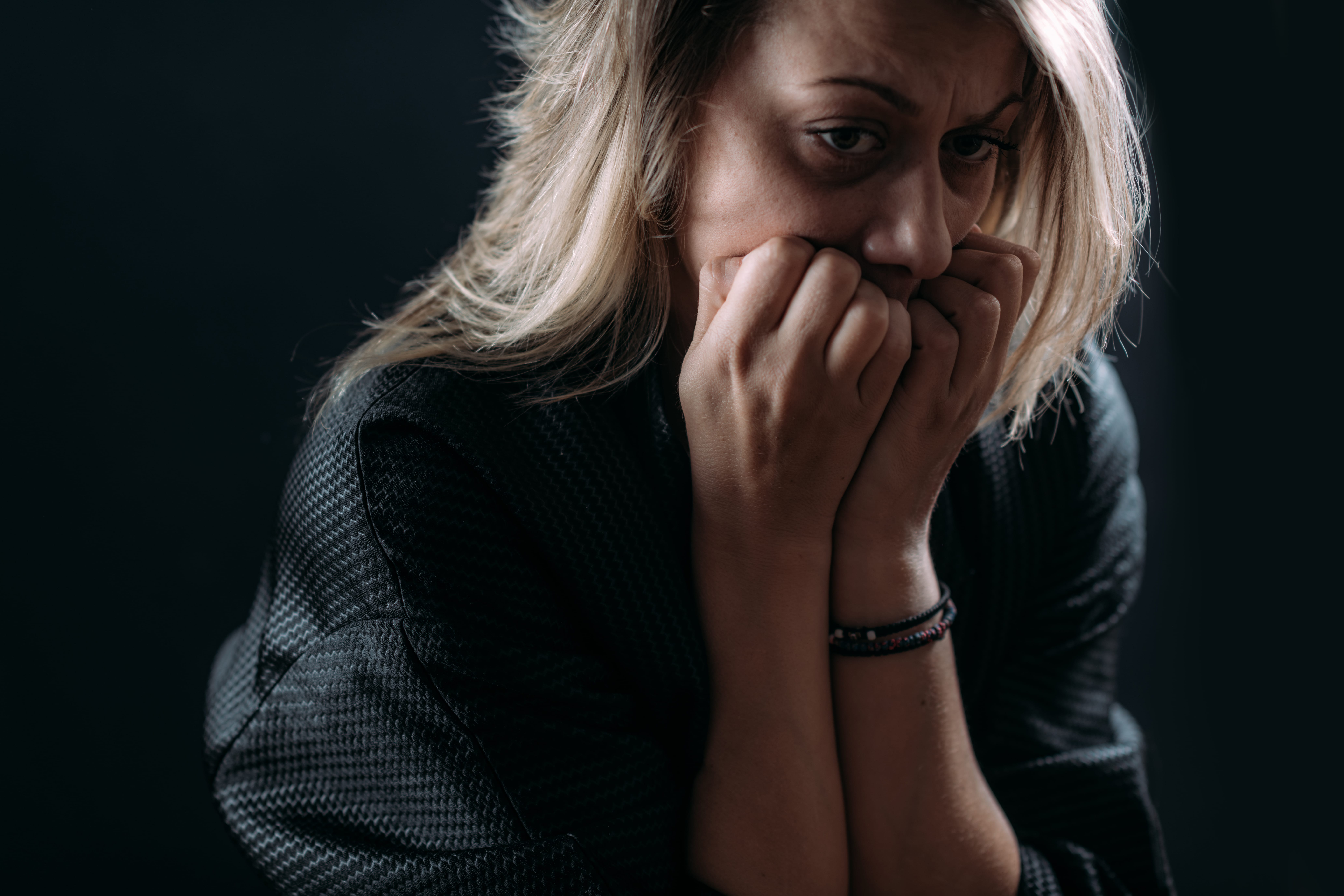 A woman suffering from postpartum depression (PPD).