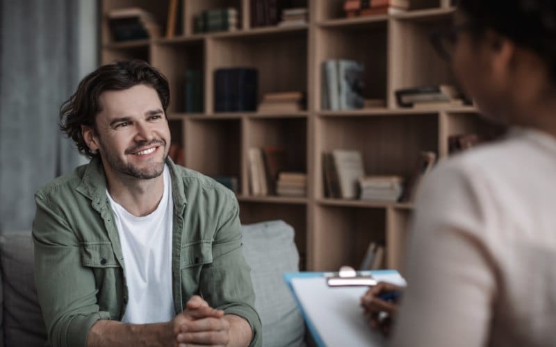 A young man in a Half-Day Outpatient Treatment Program session at a Meta Addiction Treatment facility.