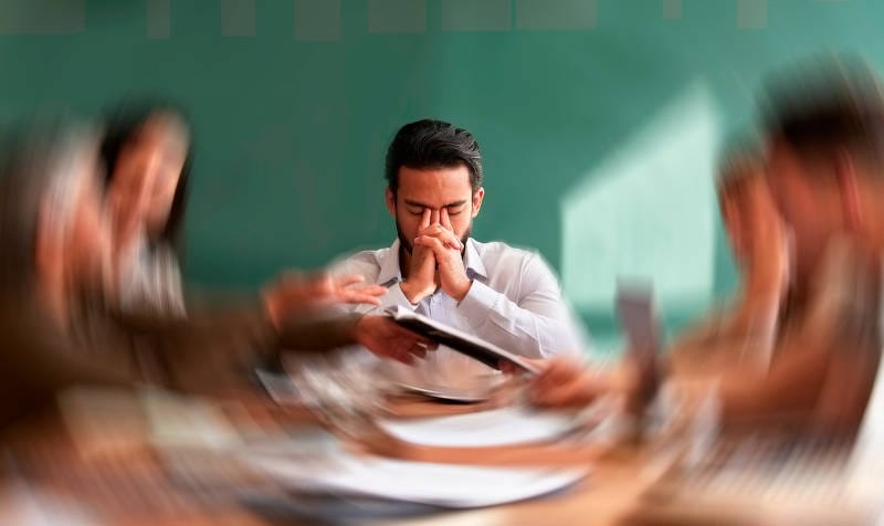 A stressed man experiencing anxiety.