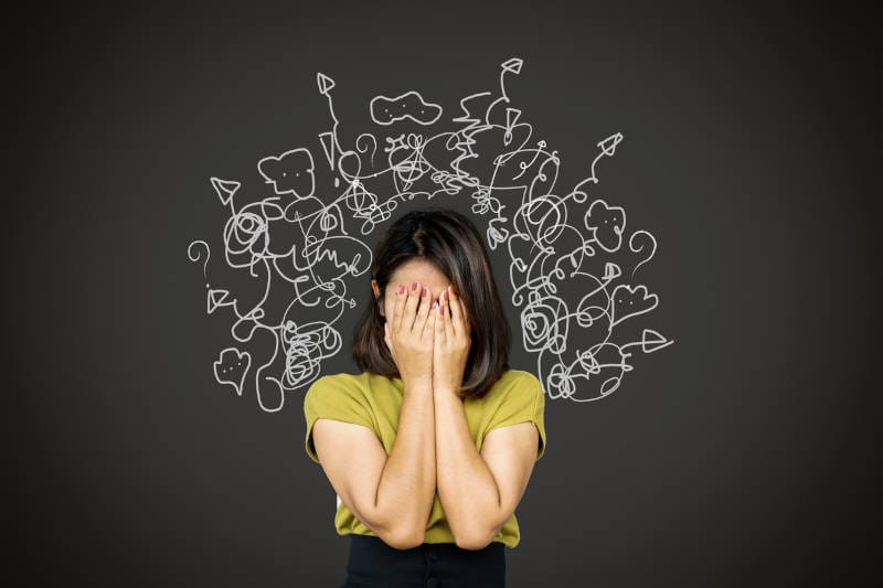 A woman experiencing a panic attack or anxiety attack.