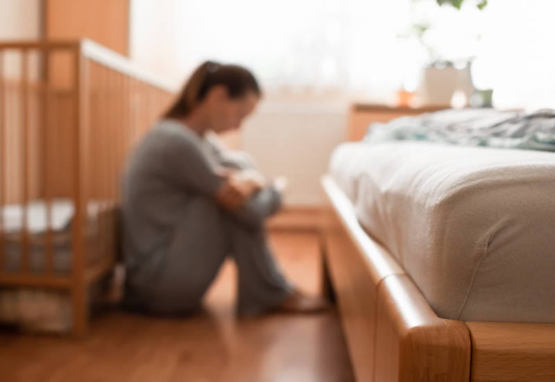 A mother experiencing postpartum psychosis.